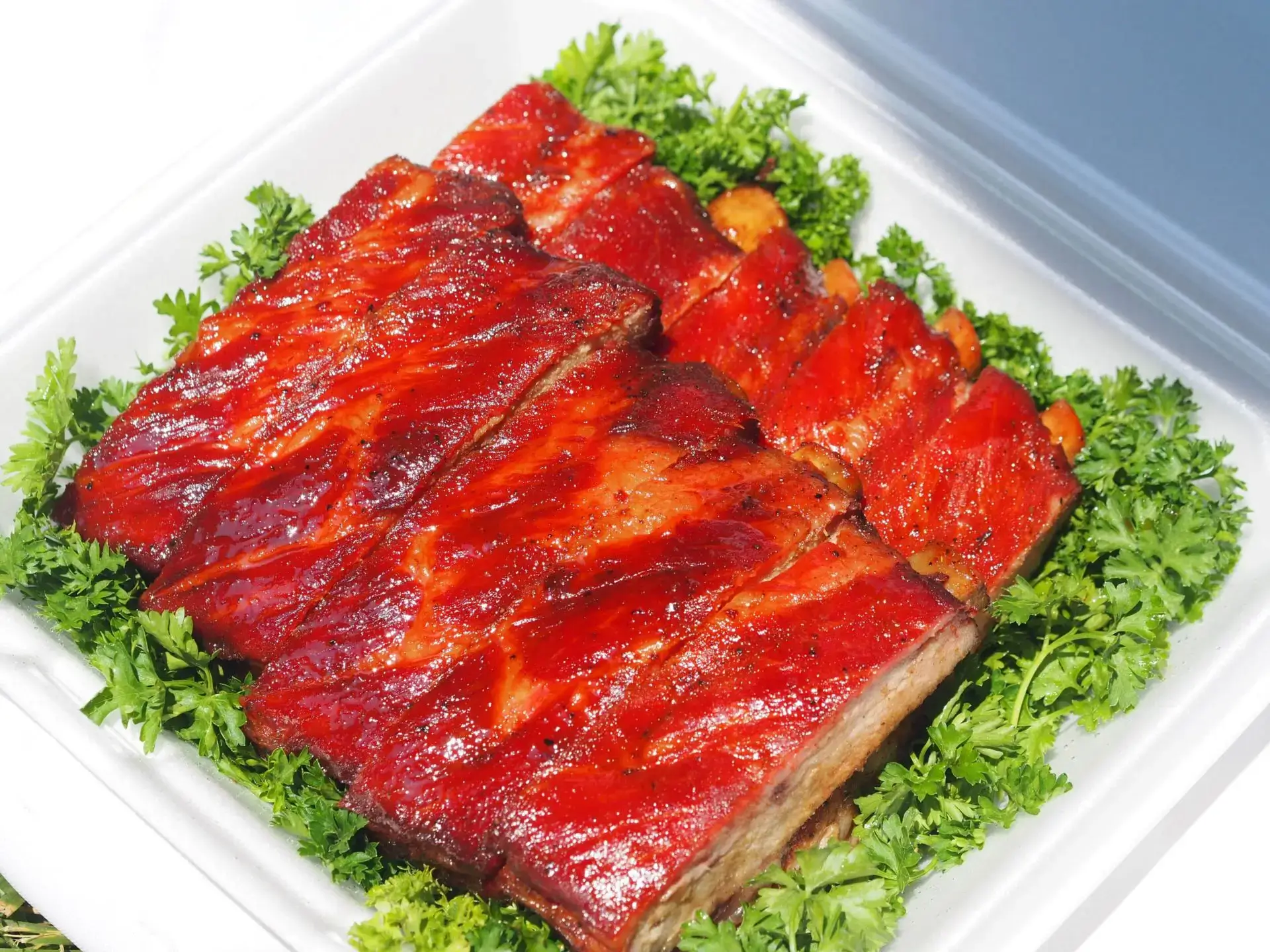 A close up of meat on top of lettuce